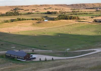 Clearwater West Big Horn, WY Equine Facility evening light view of home from above on hill august