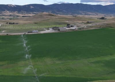 Clearwater West Big Horn, WY Equine Facility overview irrigation and hay looking south